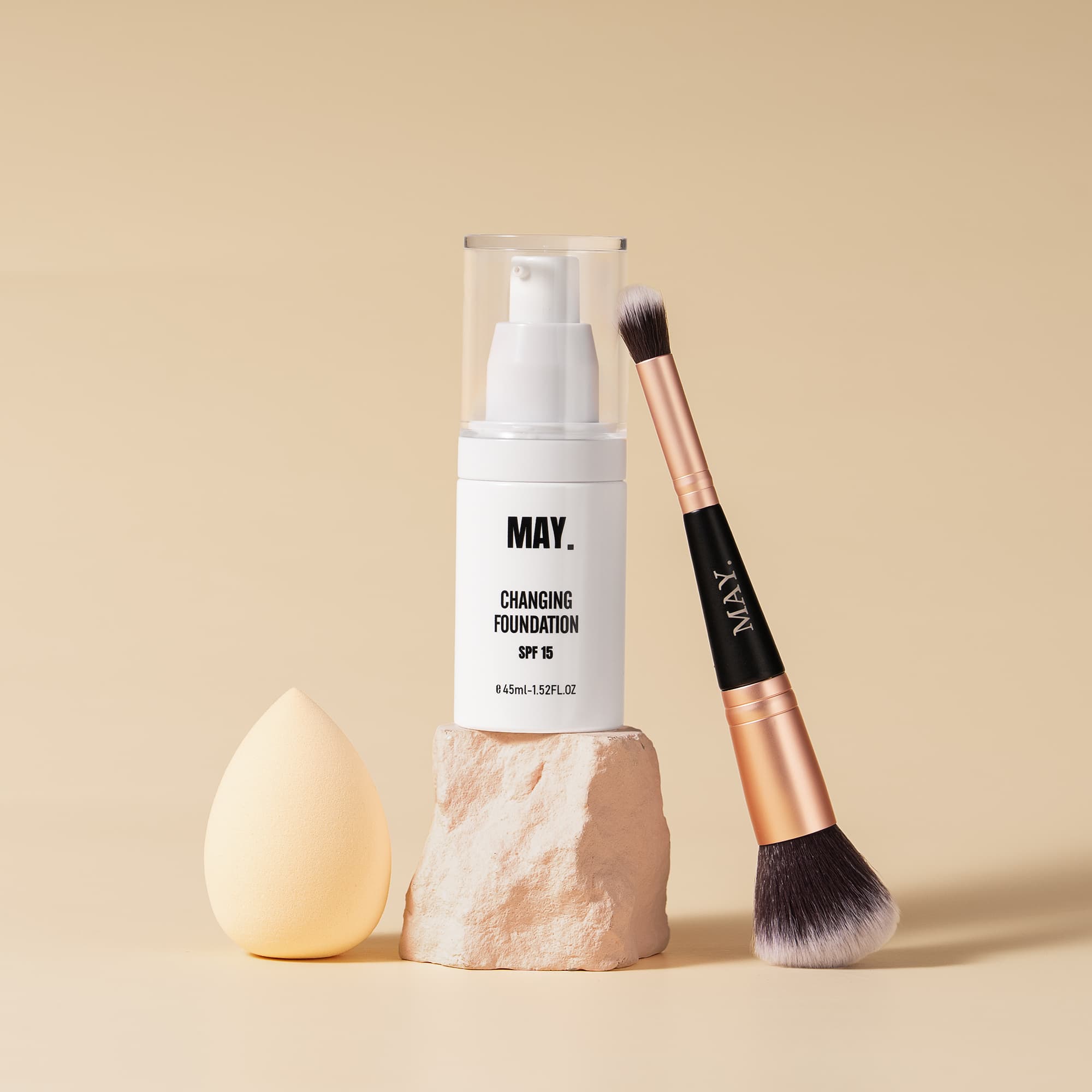 Woman holding May Cosmetics foundation